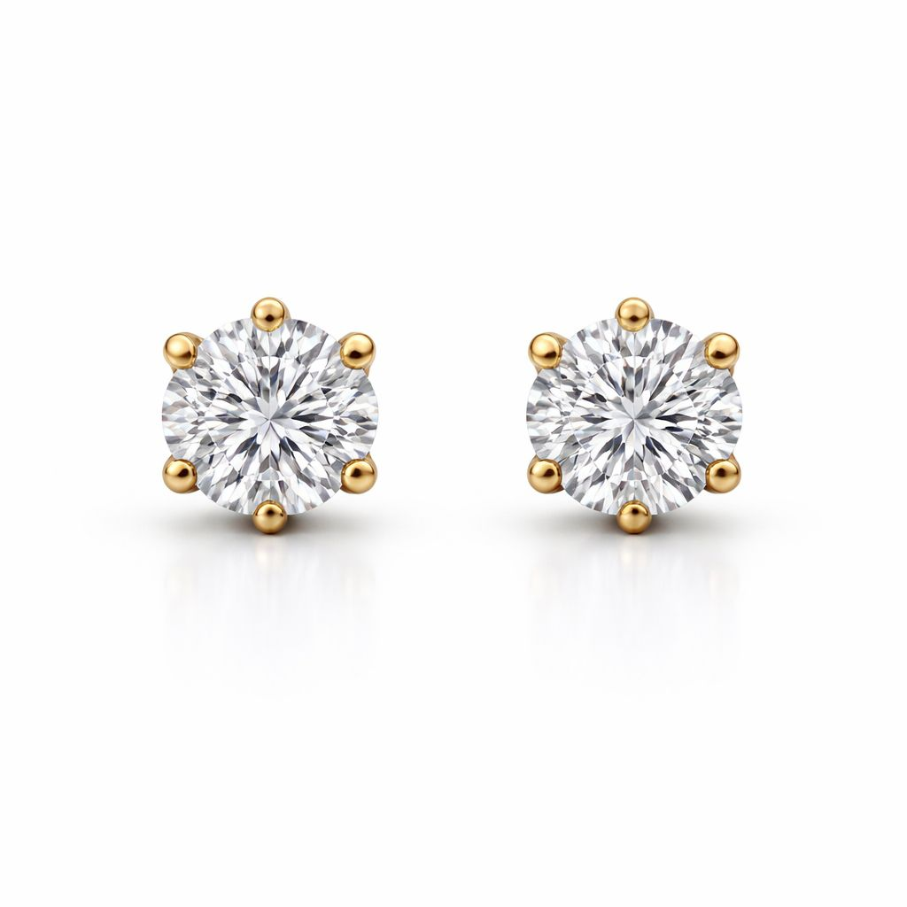 Round-cut diamond stud earrings, 1.07 ct, in 585 yellow gold.